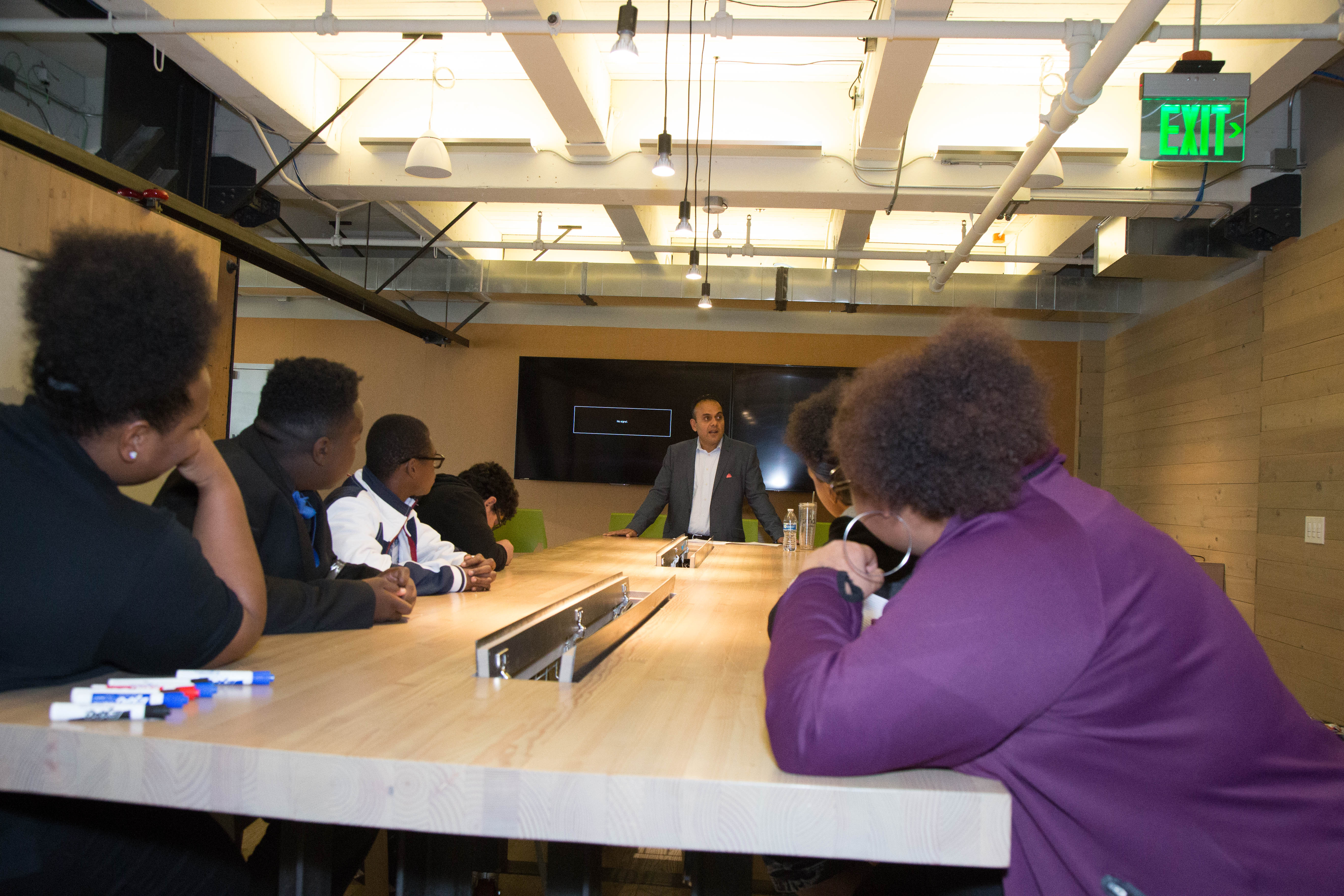 Capital One Seattle Site Lead Sunjay Pandey offers advice and encouragement to TAF students during a visit to Capital One’s downtown Seattle offices Oct. 26.