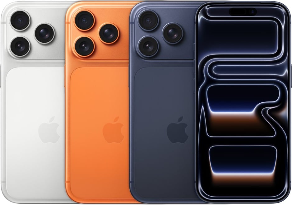 A person holding a blue iPhone showing the rear camera system