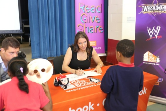 Stephanie McMahon autographs books