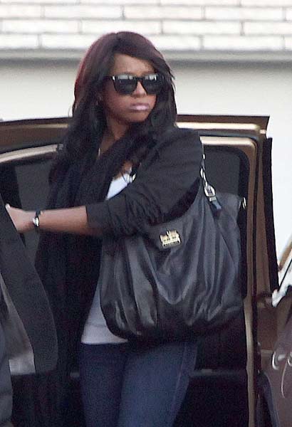 Bobbi Kristina attending her mother's funeral