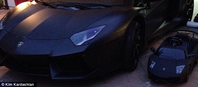 Kanye West's Lamborghini next to his daughter's mini replica of it