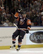 Mike Comrie celebrates after scoring a goal