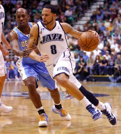 Deron Williams driving by Chauncey Billups