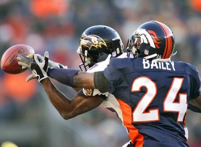 Champ Bailey of the Denver Broncos breaks it up