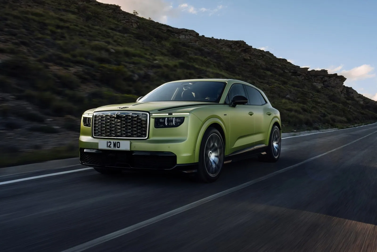Bentley Torcal electric SUV driving on a mountain road