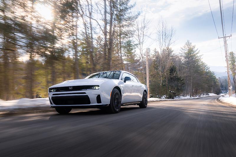 White Dodge Charger R/T four door in motion