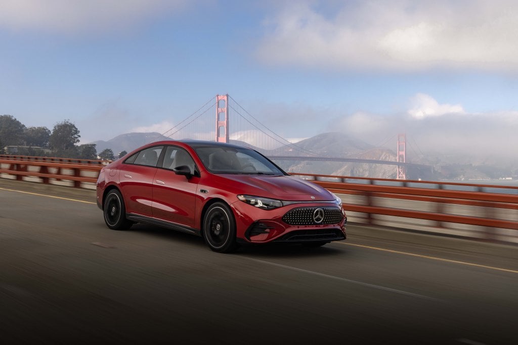 Official Mercedes-Benz electric CLA 250+ launch image: red sedan driving with the Golden Gate Bridge in the background