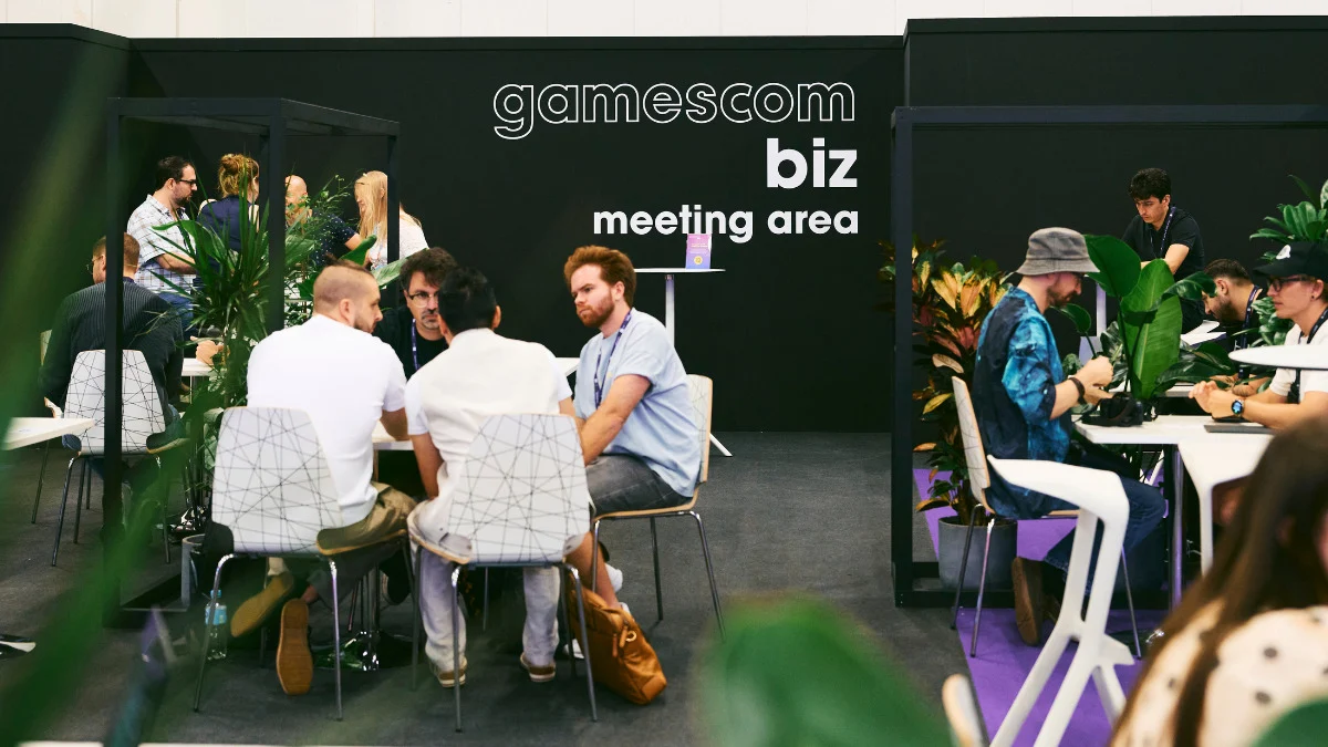 Attendees walking the crowded Gamescom show floor in Cologne, Germany