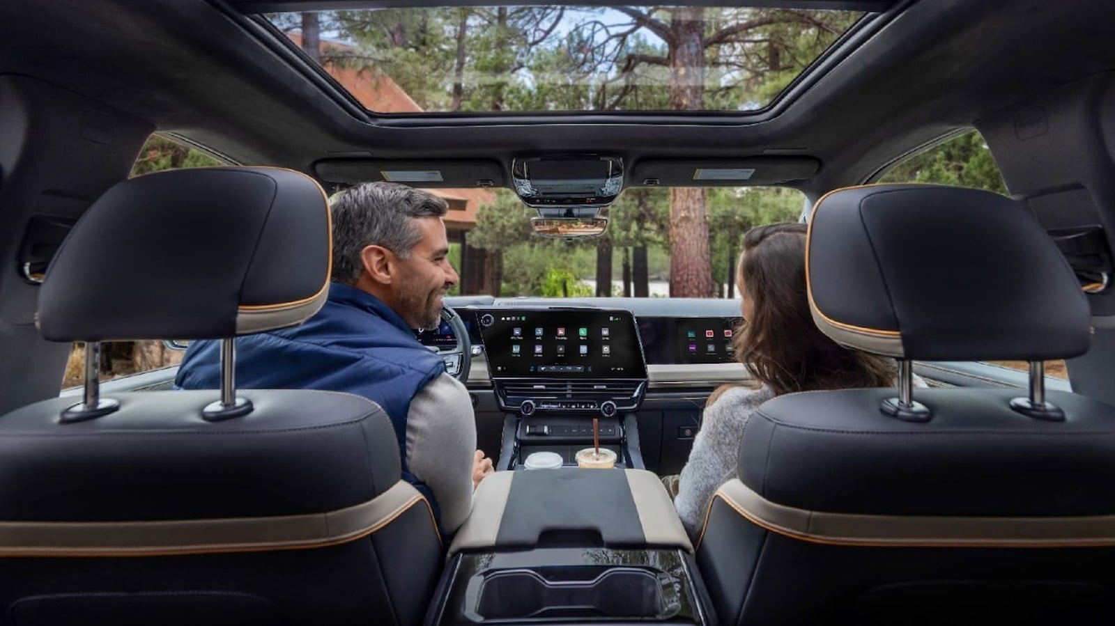 The dashboard of GM's 2027 pickup showing its new user interface, with phone projection running beside the truck's own controls