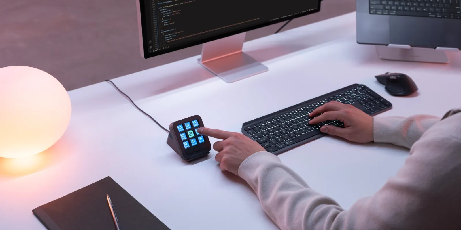 Logitech MX Keypad, a compact nine-key macro pad with full-color LCD keys, shown in Graphite