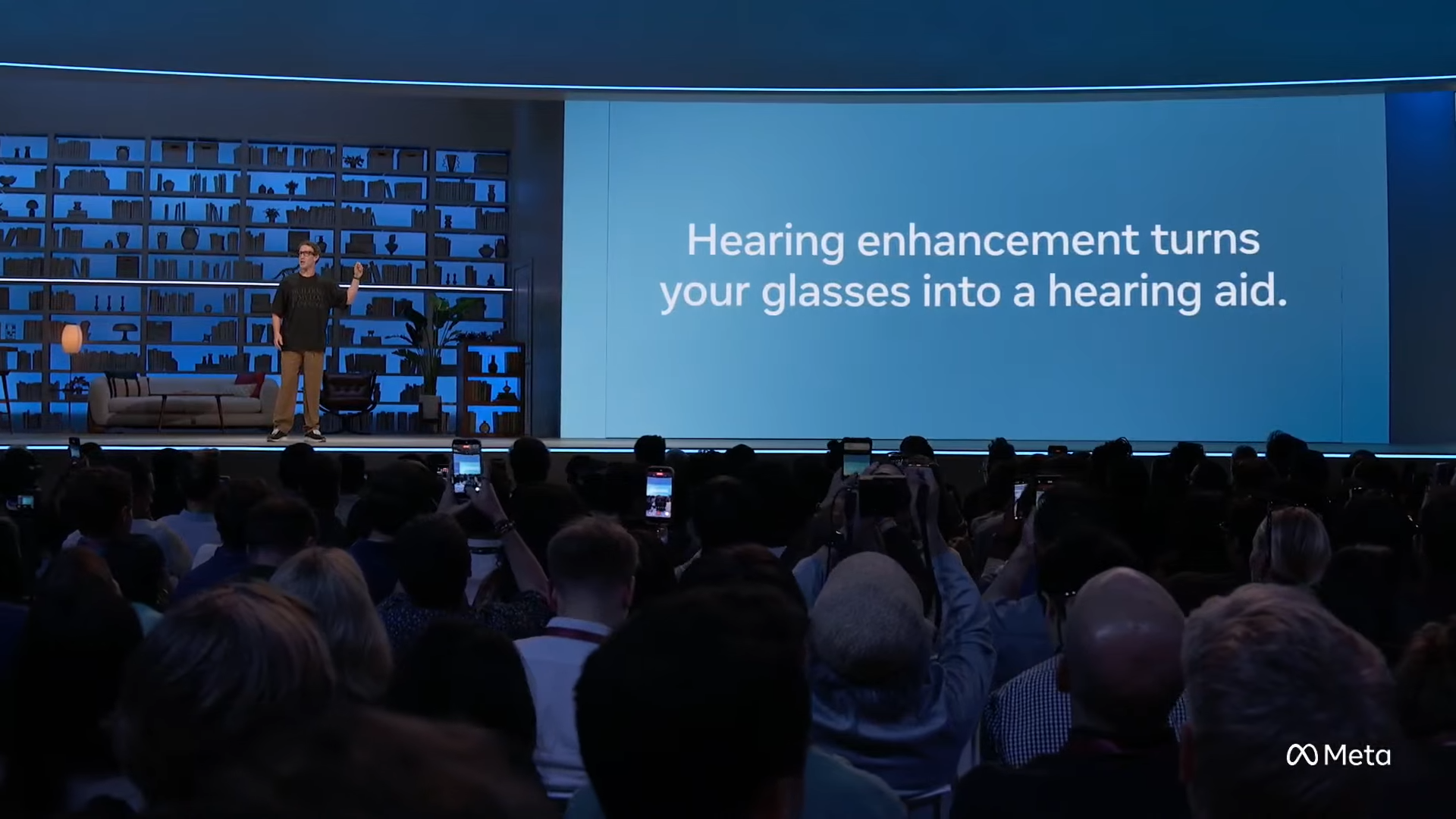 Mark Zuckerberg on stage at Meta Connect 2026 in front of a slide reading Hearing enhancement turns your glasses into a hearing aid