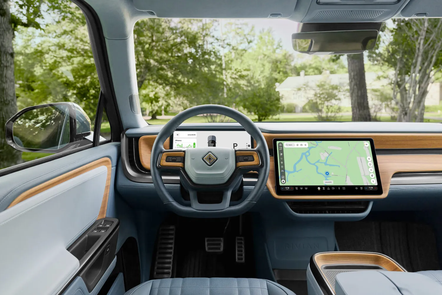 Rivian R1 interior with the center touchscreen running the redesigned RivianOS 2 interface