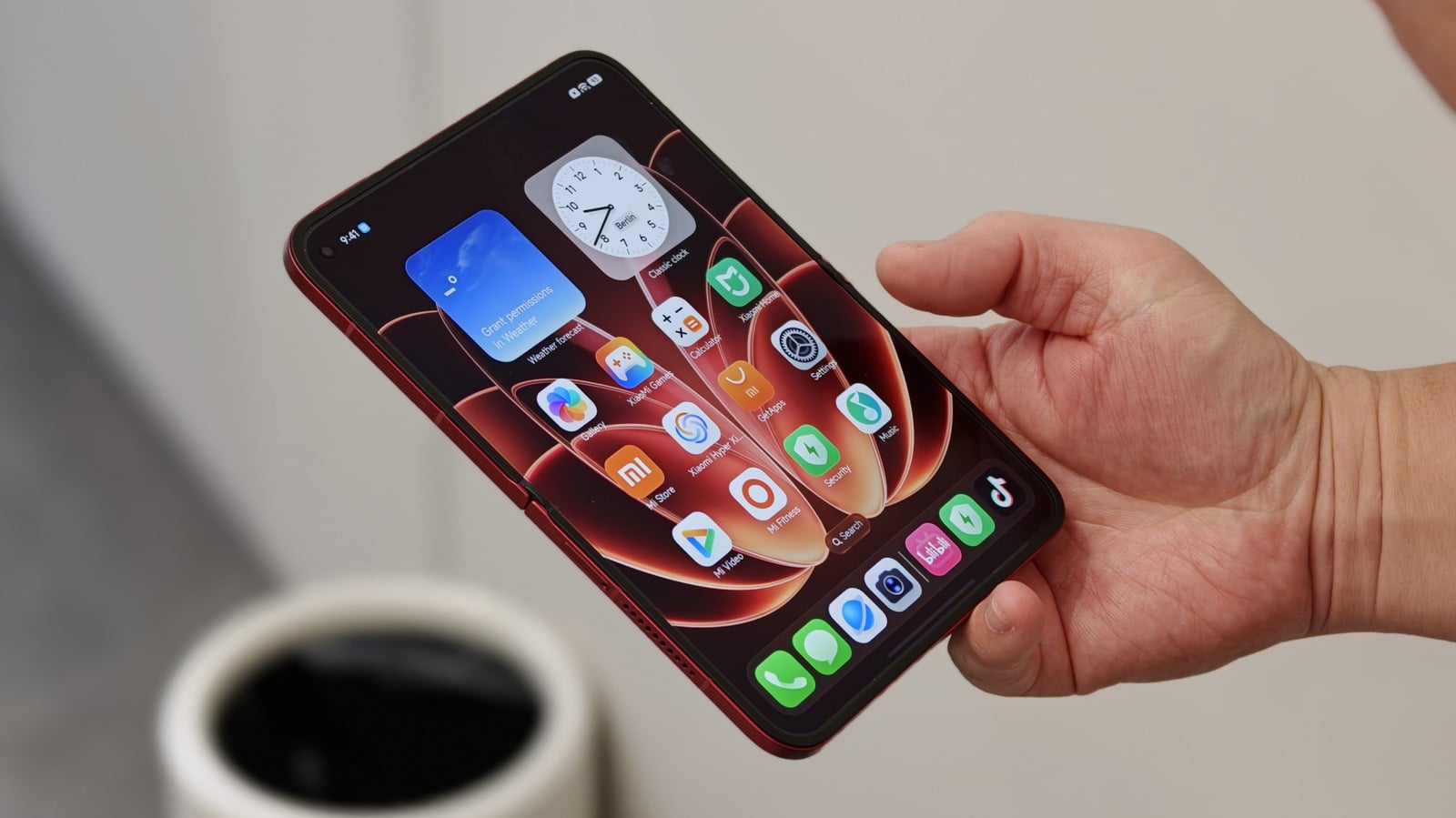 Xiaomi 18 Fold foldable phone on display at IFA 2026 in Berlin, shown in red with its Leica triple camera visor across the back